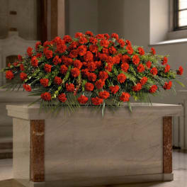 Large red carnation arrangement on a stone pedestal