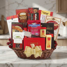 Basket of assorted chocolates, cookies, and candies with a ribbon bow