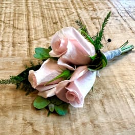 Boutonniere with pale pink roses and greenery