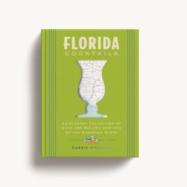Green cookbook titled Florida Cocktails with a map-shaped glass illustration