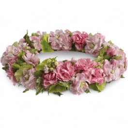 Pink and lavender flower lei with green accents