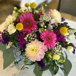 Mixed bouquet with pink gerbera daisies and pastel blooms