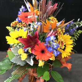 Colorful mixed bouquet with sunflowers, gerbera daisies, and lilies