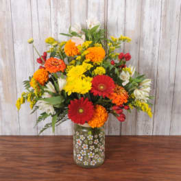 Colorful mixed bouquet in a painted glass vase