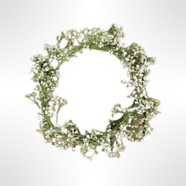 Small floral wreath of tiny white blossoms on a white background