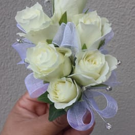 Small bouquet of white roses with lavender ribbon and crystal picks