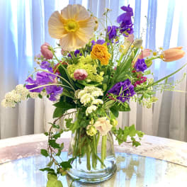 Colorful mixed bouquet in a clear glass vase
