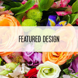 Mixed bouquet with orange roses and pink lilies behind a featured design banner.