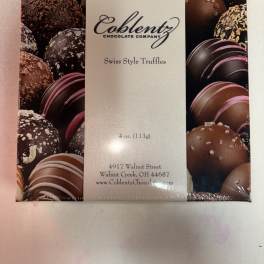 Box of assorted chocolate truffles in plastic wrap
