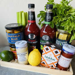 Gift tray with Bloody Mary mix, olives, celery, lemon, and condiments