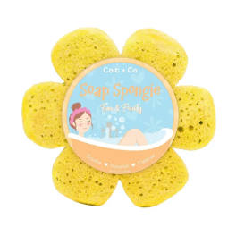 Yellow flower-shaped soap sponge with a round label in the center