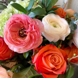 Close-up bouquet of pink, white, and orange flowers