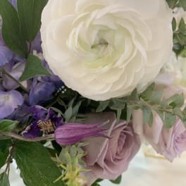 Bouquet with white and lavender flowers and green foliage