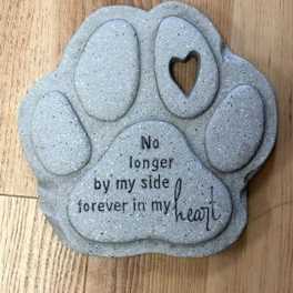 Gray paw-shaped memorial plaque with the words "No longer by my side forever in my heart"