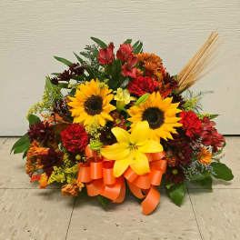 Autumn floral arrangement with sunflowers and orange ribbon