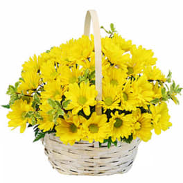 Yellow daisy bouquet in a wicker basket with a handle
