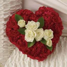 Heart-shaped bouquet of red carnations with white roses