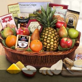 Fruit and cheese gift basket with crackers and packaged snacks