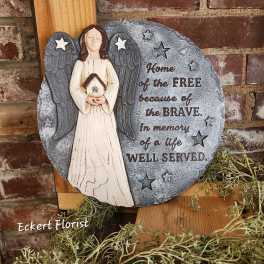 Angel memorial plaque with stars and engraved tribute text