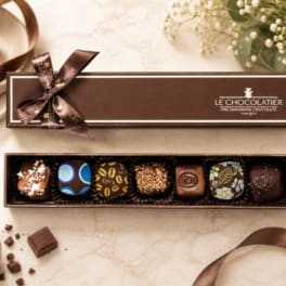 Box of assorted chocolates with a ribbon bow