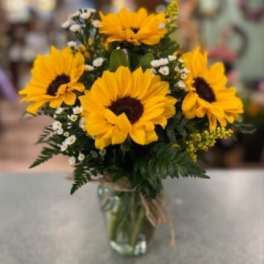 Sunflower bouquet in a clear glass vase