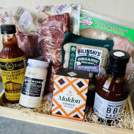 Gift basket with sauces, salt, and packaged meats