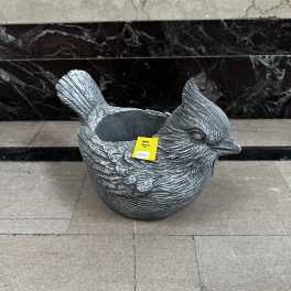 Bird-shaped planter with a hollow center and price tag