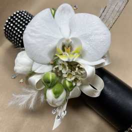 White orchid corsage with ribbon and crystal accents