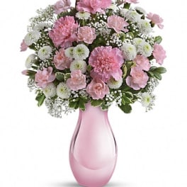 Pink and white bouquet in a pink glass vase