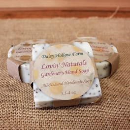 Wrapped bars of handmade soap with garden-themed labels