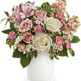 Pink and white roses with alstroemeria in a white vase