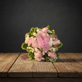 Pink rose bouquet with a sheer ribbon and white filler flowers
