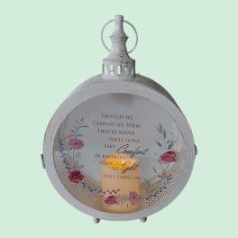 Decorative lantern with a memorial quote and floral accents