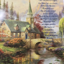 Decorative print of a stone church by a stream with the Lord's Prayer text