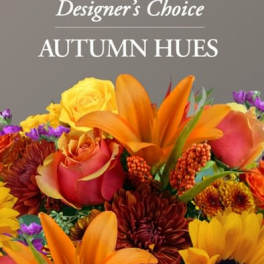 Autumn bouquet with orange lilies, roses, and yellow and purple flowers