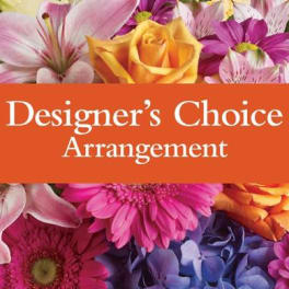 Colorful mixed flowers behind an orange banner reading Designer's Choice Arrangement