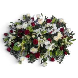 Large mixed bouquet of red and white flowers with greenery