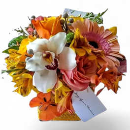 Mixed bouquet with orange, pink, white, and yellow flowers