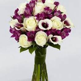 Bouquet of white roses and purple calla lilies