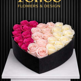 Heart-shaped box of pink and white roses