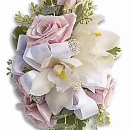 Pink roses and white orchids with a lavender ribbon