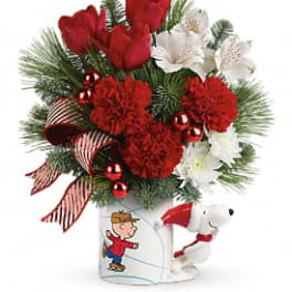 Christmas bouquet with red and white flowers in a Snoopy mug