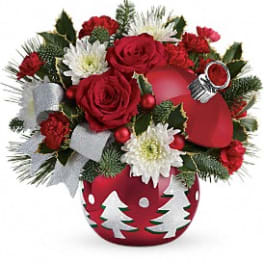 Christmas bouquet with red roses, white daisies, and a red ornament vase