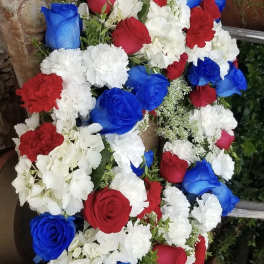 Bouquet of red, white, and blue roses with white carnations