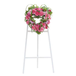 Pink floral wreath on a white standing easel