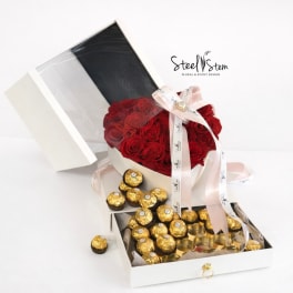 Heart-shaped red rose box with Ferrero Rocher chocolates and ribbon
