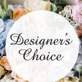 Round sign reading "Designer's Choice" surrounded by pastel flowers