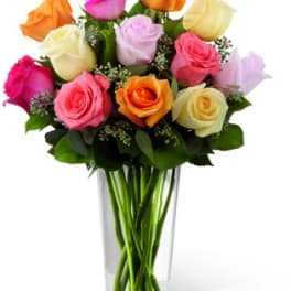 Mixed roses in a clear glass vase