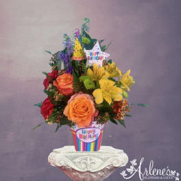 Birthday bouquet in a striped pot with a star topper