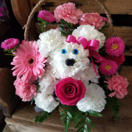 Pink and white flower basket shaped like a teddy bear with a ribbon bow